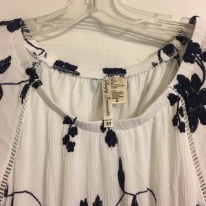 Short white dress with navy embroidered flowers